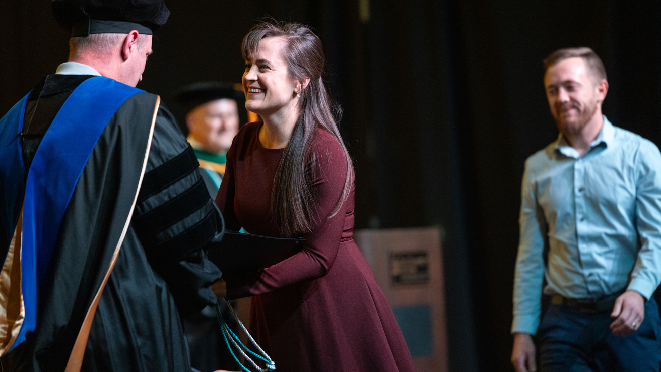 PA Program Alumni Receiving Pi Alpha Honor Society Certificate and Commencement Cords