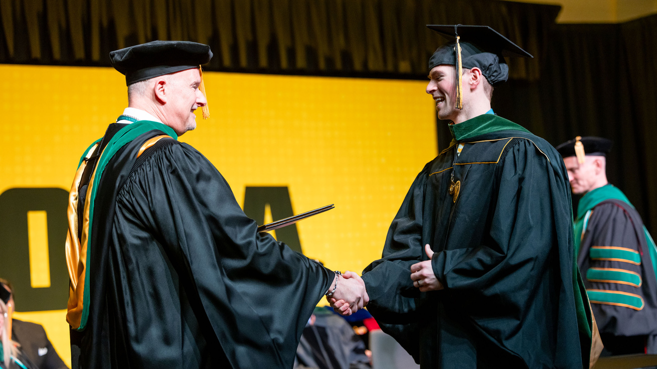 PA Graduate Receiving Diploma from Program Director